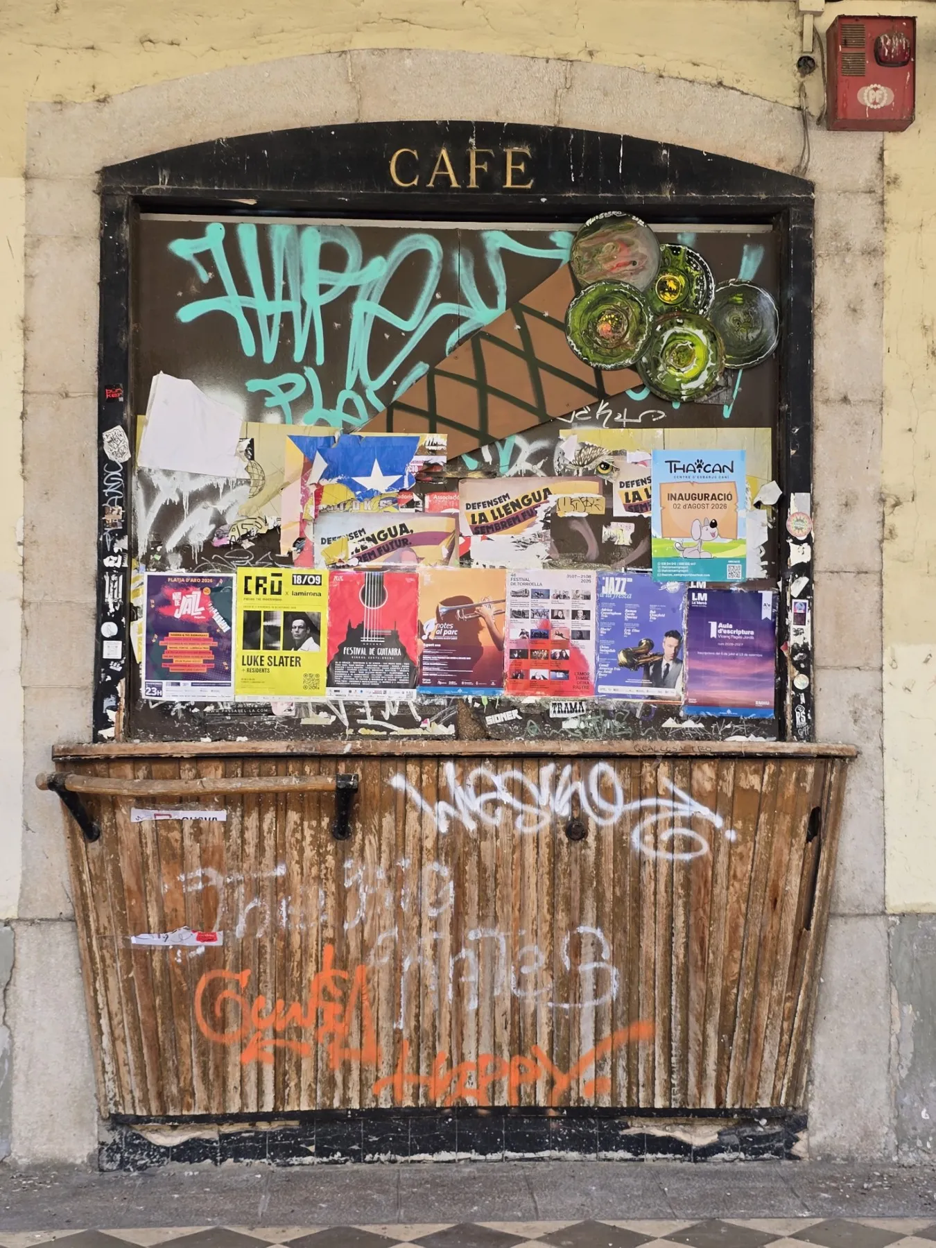 Closed down bar covered in posters