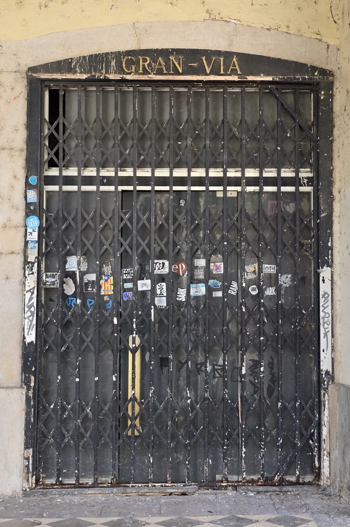 Closed café entrance behind a fence